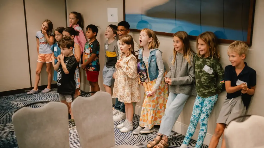 Children singing together in a Trinity Kids room on a Sunday morning